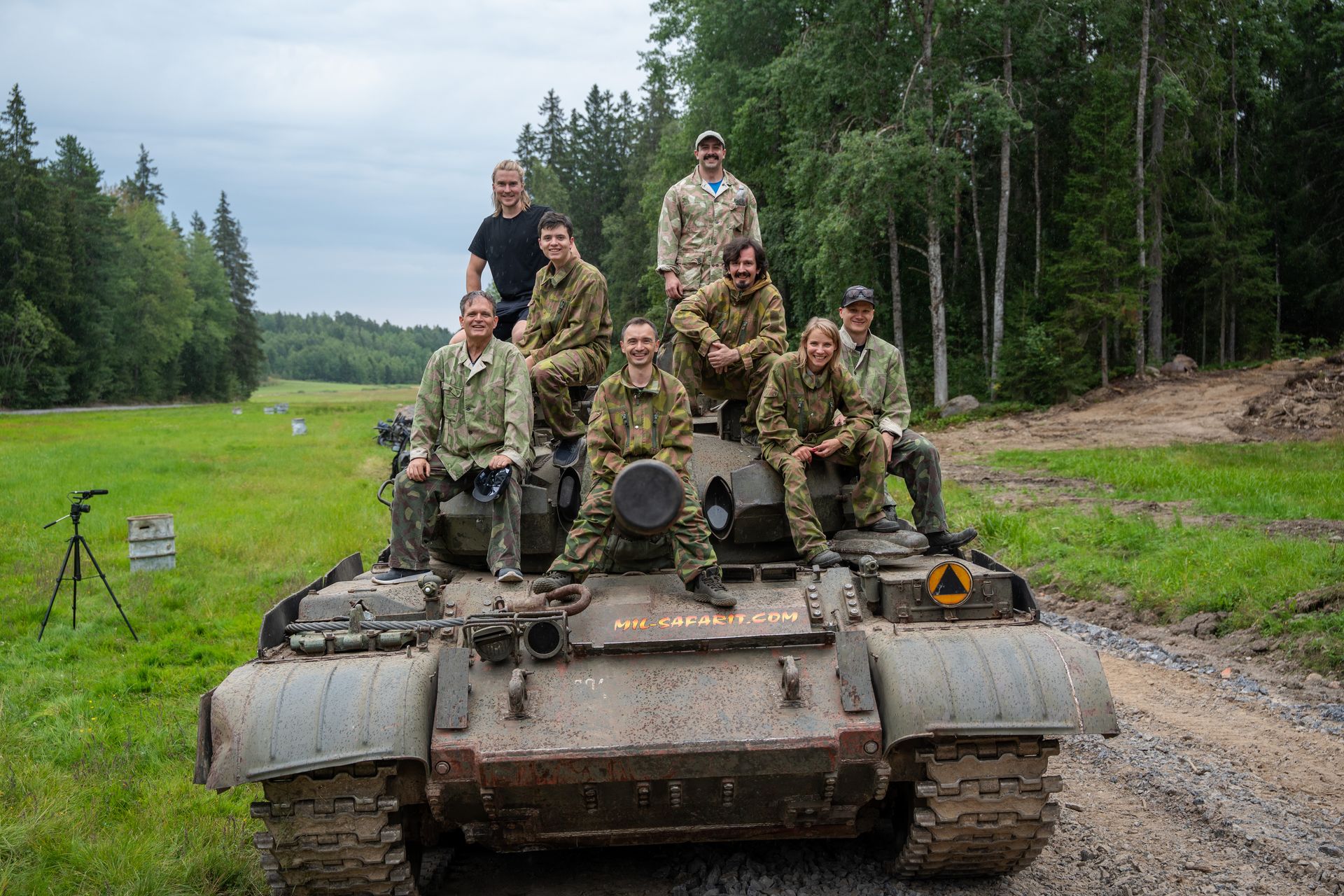 The Summer Mayhem Finland group sitting on top of a tank